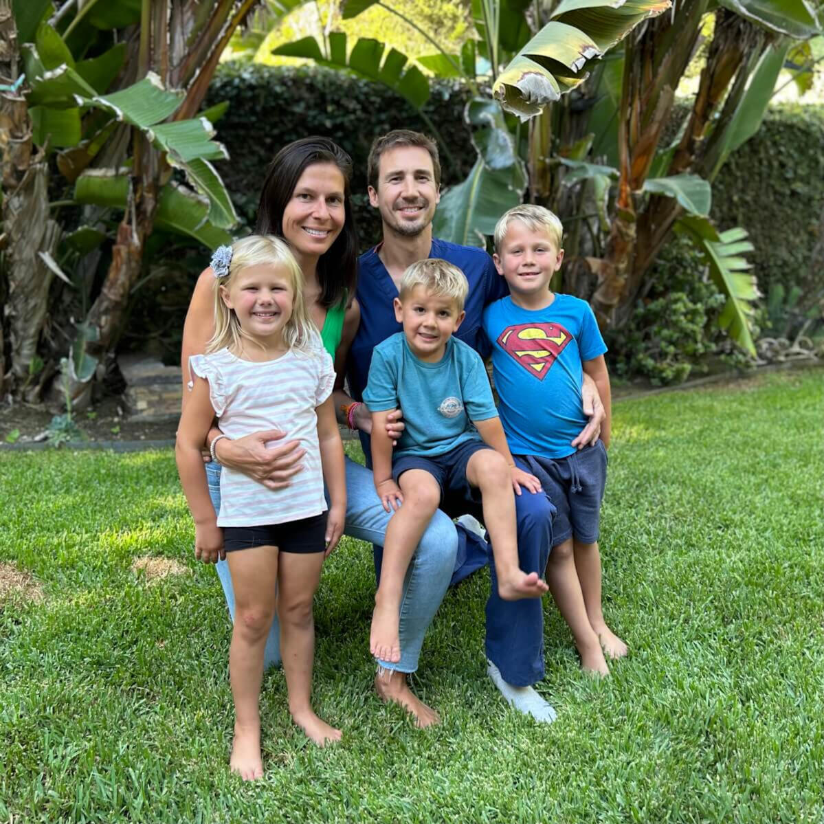 Dr. Reed Poole with his wife and three children standing outdoors.